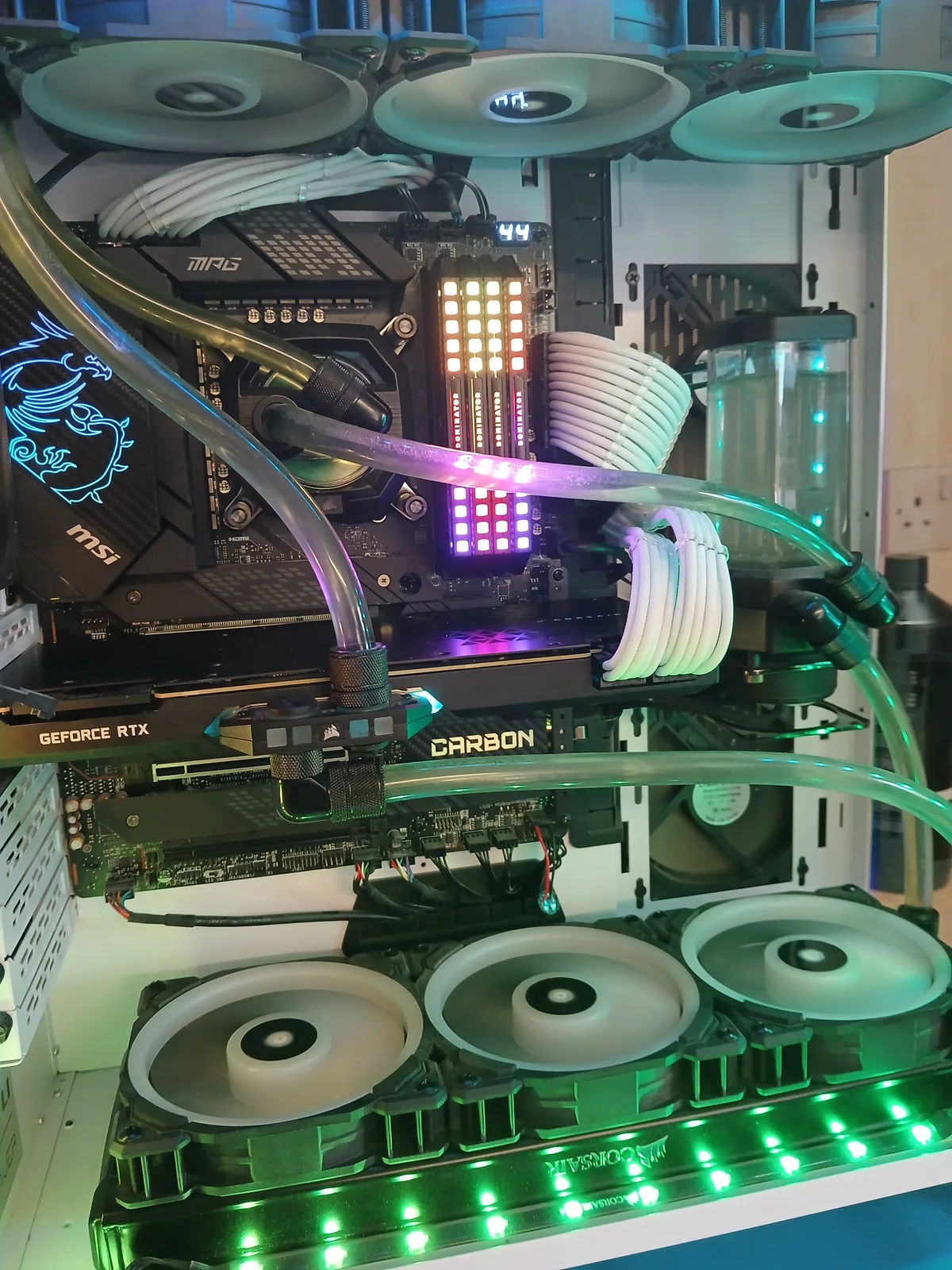 Custom water-cooled gaming PC serviced in Harold Hill — MSI motherboard, RTX GPU under a clear water block, fresh coolant in the loop